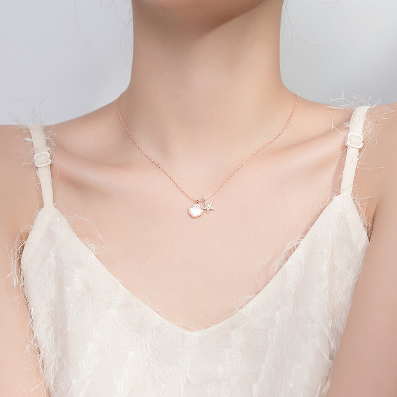 Collar de estrella de mar, color de plata y acero con dijes de mar