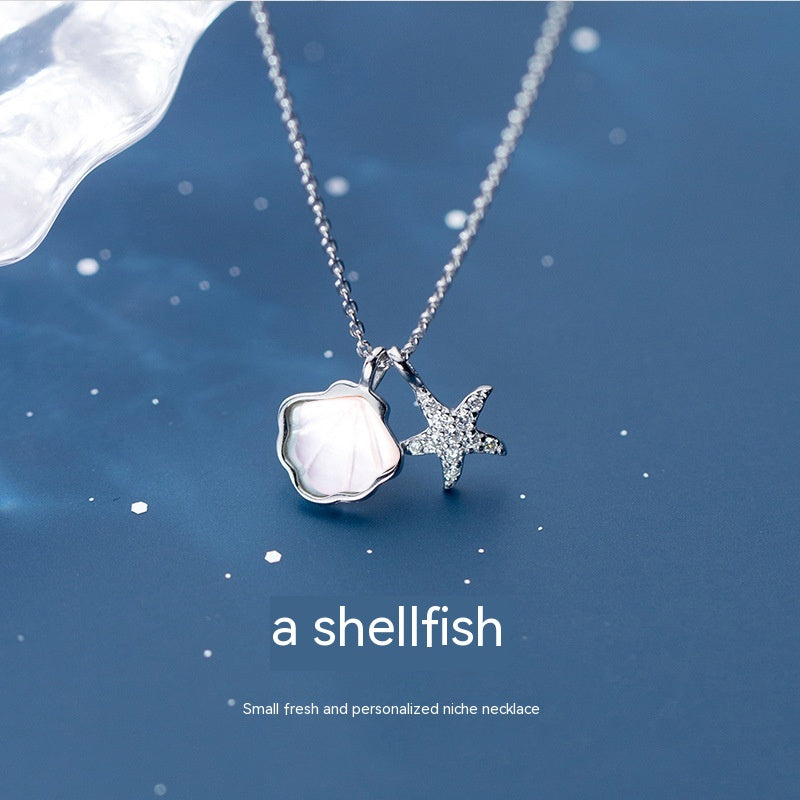 Collar de estrella de mar, color de plata y acero con dijes de mar