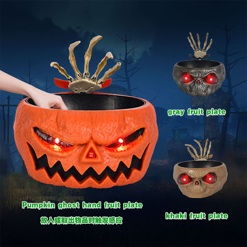 Cuenco de calabaza de plástico para dulces de Halloween con mano que se activa por movimiento.