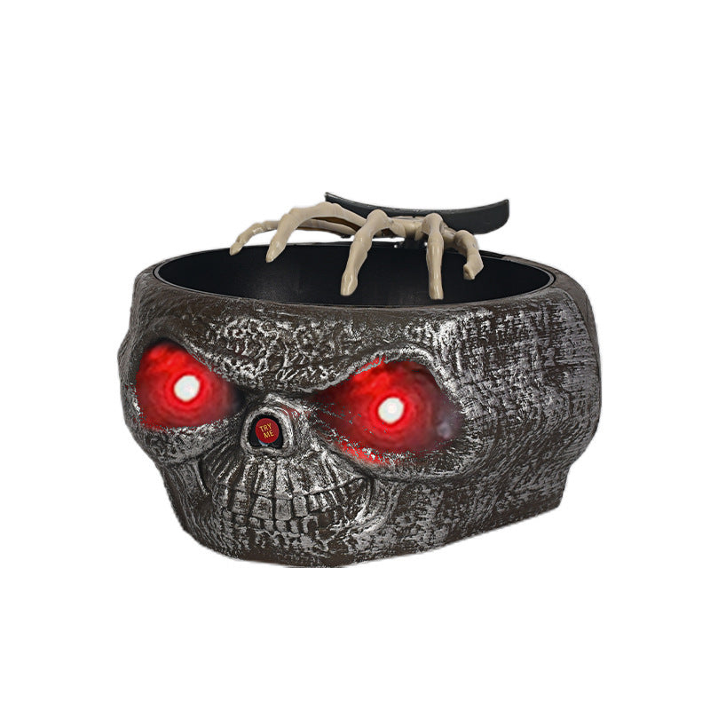 Cuenco de calabaza de plástico para dulces de Halloween con mano que se activa por movimiento.