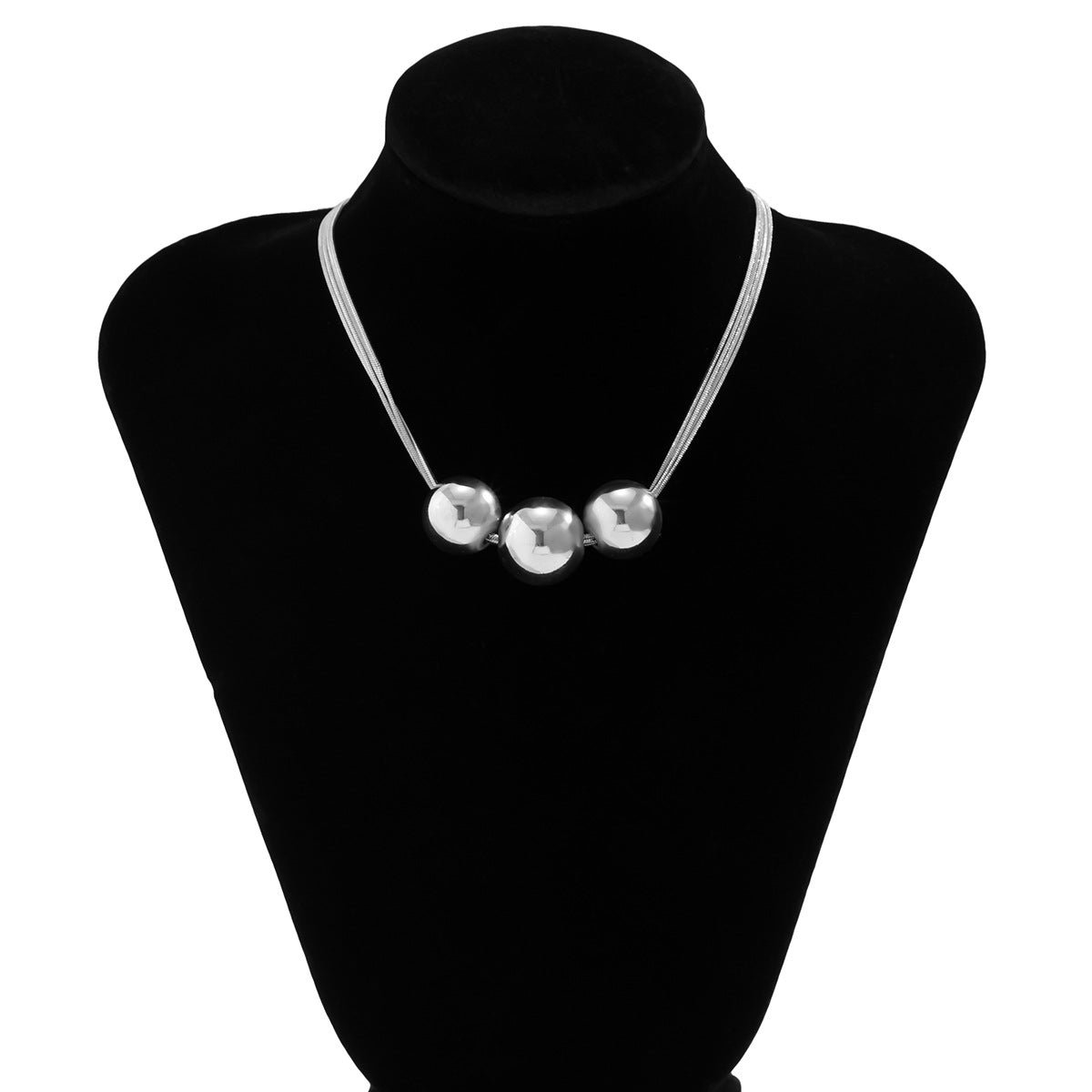 Collar multicapa con bola geométrica en dorado y plateado