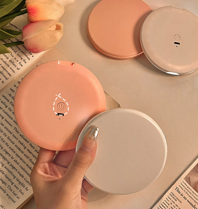 Espejo cosmético portátil con luz LED para maquillaje.