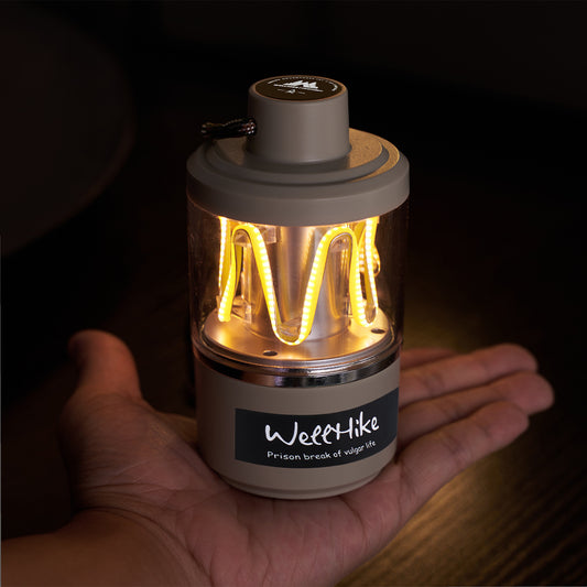 Lámpara de mesa decorativa ligera para acampar al aire libre.
