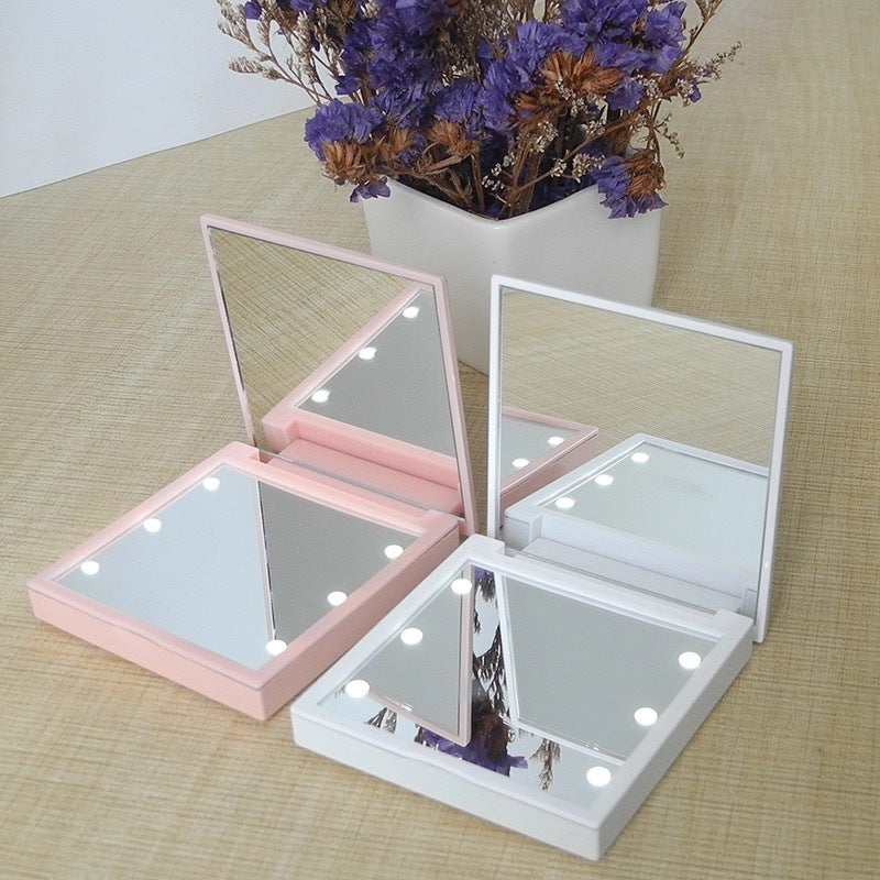 Espejo cosmético portátil plegable de doble cara con luz LED