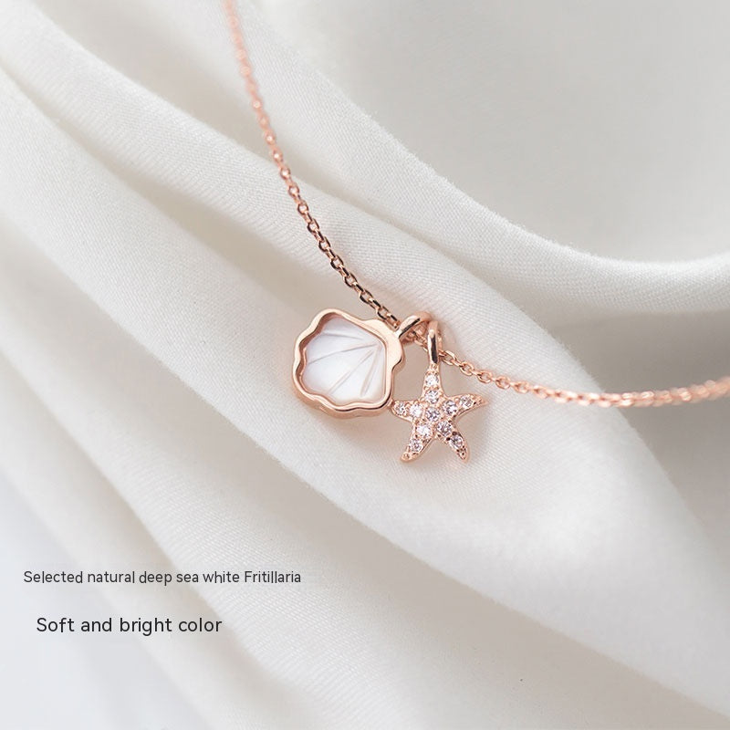 Collar de estrella de mar, color de plata y acero con dijes de mar