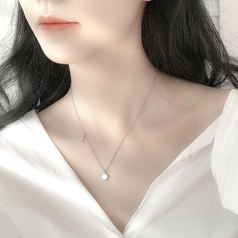 Collar de estrella de mar, color de plata y acero con dijes de mar