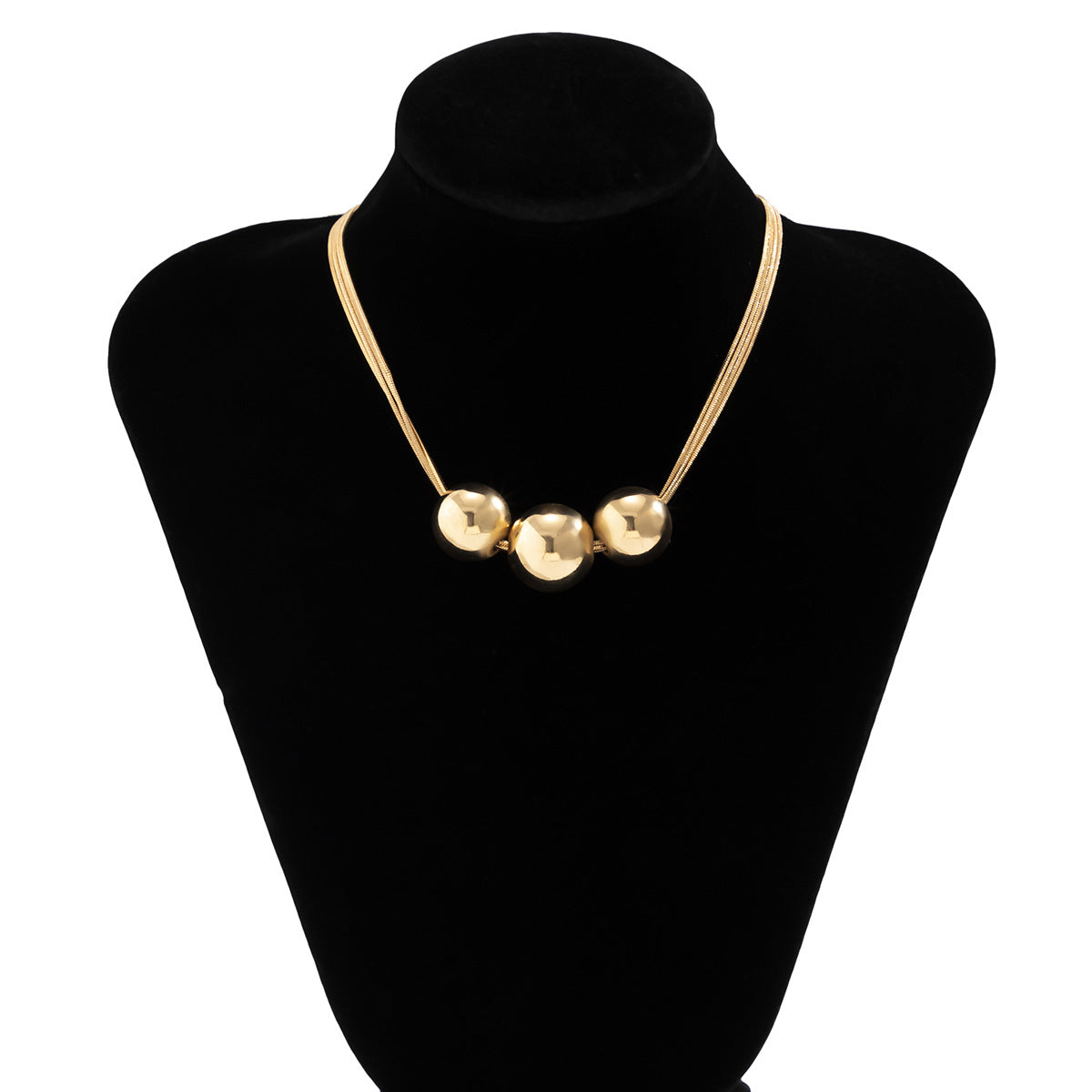 Collar multicapa con bola geométrica en dorado y plateado